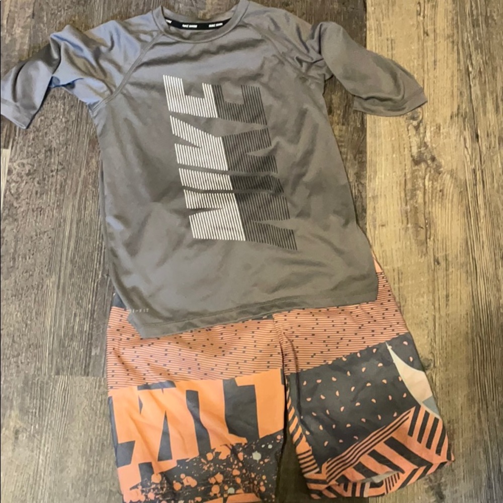 Nike swimming trunks and rash guard.
